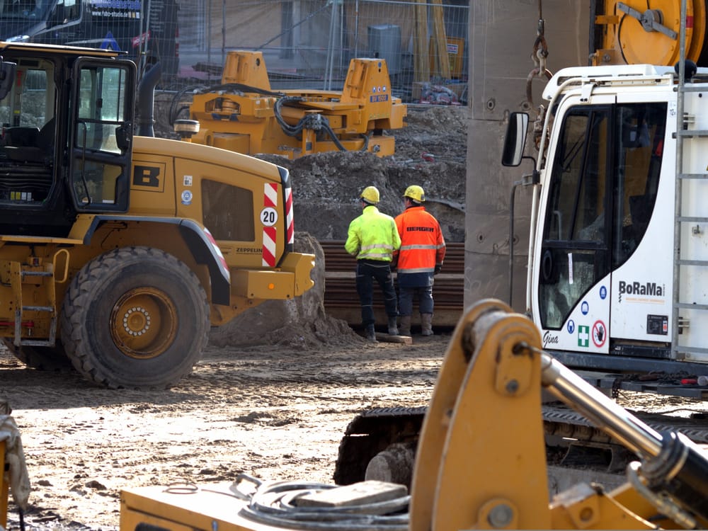 Construction crew and heavy equipment on a job site