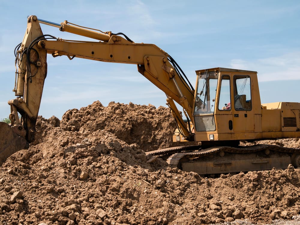 Excavator moving earth on a job site